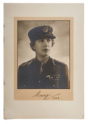 Lot 78 - H.R.H. Princess Mary The Princess Royal and Countess of Harewood, signed 1942 wartime presentation portrait photograph by Dorothy Wilding of the Princess in military uniform signed in ink on mount...