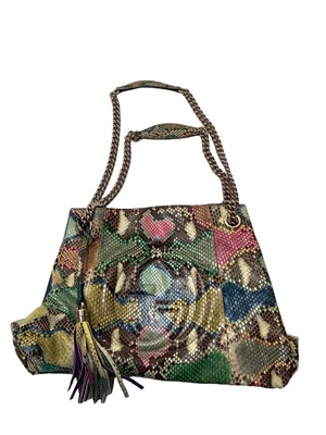 Lot 2073 - Gucci multicoloured python tote bag with removable tassel and chain shoulder strap, interlocking GG logo stitching.  Soft bag and paper carrier bag both Gucci. 308982  001998