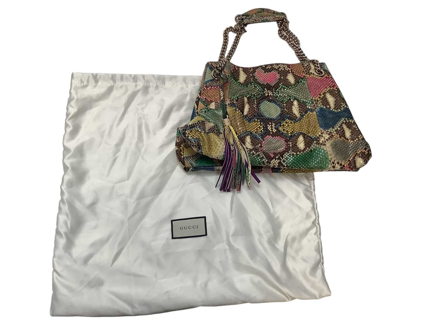 Lot 2073 - Gucci multicoloured python tote bag with removable tassel and chain shoulder strap, interlocking GG logo stitching.  Soft bag and paper carrier bag both Gucci. 308982  001998