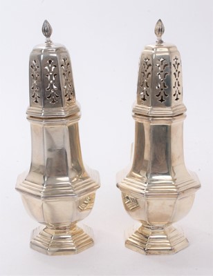 Lot 586 - Pair Georgian style silver octagonal sugar castors