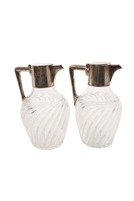 Lot 591 - Pair of Continental silver (800) mounted and cut glass claret jugs