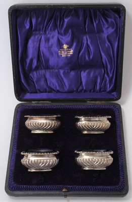 Lot 589 - Set of four Edwardian silver salts in fitted case