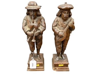 Lot 2494 - Pair of carved oak figures of musicians