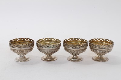 Lot 437 - Set of four silver salts of urn form.