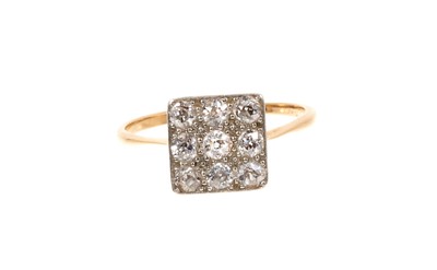 Lot 669 - 1920s diamond cluster ring with a square cluster of nine old cut diamonds in platinum pavé-setting on pierced gold gallery and 18ct gold shank. Estimated total diamond weight approximately 0.60cts.