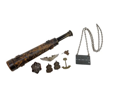 Lot 712 - Second World War Prisoner of War Staglag IV B dog tag, together with a Second World War enamel (possibly Polish) badge, two silver ARP badges, American badge and leather covered scope.