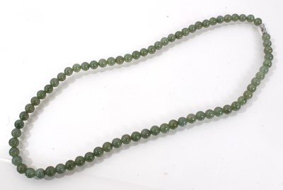 Lot 806 - Jadeite jade bead necklace with a string of 7.1-7.5mm spherical beads accompanied by a GIA certificate stating no indications of impregnation/treatment. 54cm length.