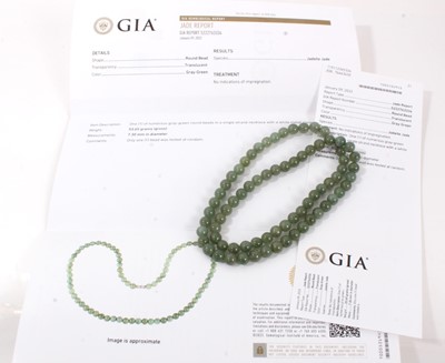 Lot 806 - Jadeite jade bead necklace with a string of 7.1-7.5mm spherical beads accompanied by a GIA certificate stating no indications of impregnation/treatment. 54cm length.
