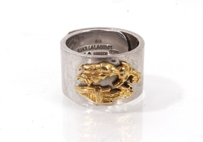 Lot 827 - Lalaounis silver and gold ring with an applied yellow gold abstract figure on a wide silver band, signed.