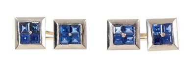 Lot 808 - Pair of blue sapphire and platinum cufflinks, each with a square cluster of four square-cut blue sapphires in platinum setting.