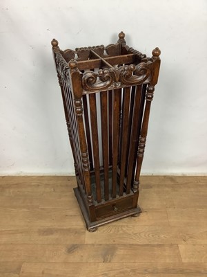 Lot 1591 - Early 20th century carved oak stick stand, with carved frieze and slatted sides, 84cm high