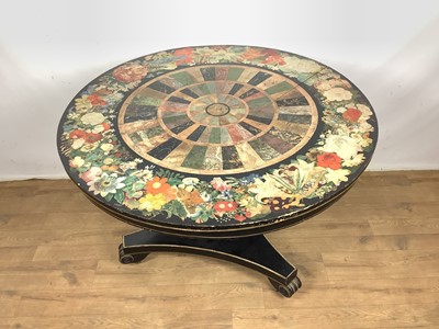 Lot 1593 - Unusual Regency ebonised and faux pietra dura breakfast table, the circular tilt top, painted with floral border and concentric faux specimen marble panels, on facetted column and triform platform...