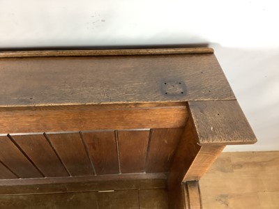 Lot 1596 - Victorian oak pew, with hinged seat and high ledge back, tracery ornament to the solid ends, 132cm long