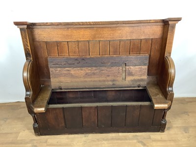 Lot 1596 - Victorian oak pew, with hinged seat and high ledge back, tracery ornament to the solid ends, 132cm long