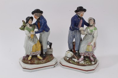 Lot 224 - A pair of early 19th century Staffordshire pearlware glazed groups of 'The Sailor's Farewell', on red-lined square canted bases, 23cm high