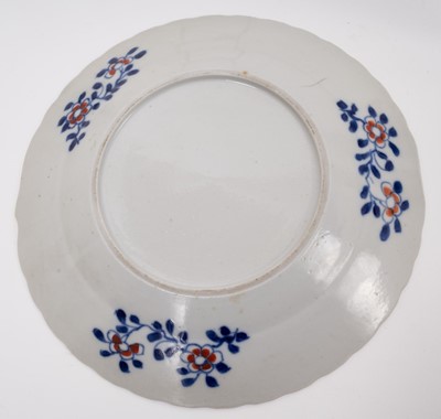 Lot 283 - A set of six Chinese Qianlong period porcelain dishes, of fluted form, polychrome decorated in the 'Tobacco Leaf' pattern, 19.5cm diameter