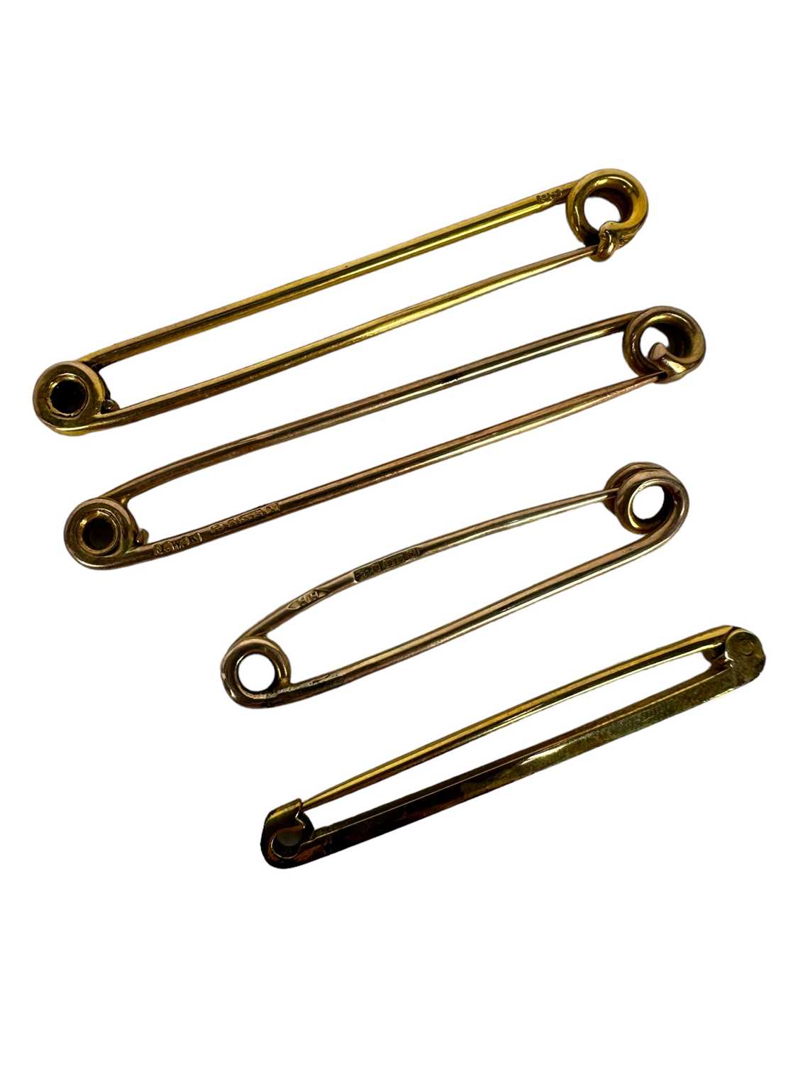 Lot 1213 Four antique 9ct gold stock pins, various
