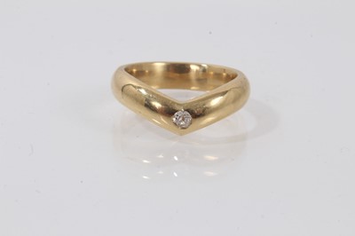 Lot 684 - 18ct gold wishbone ring set with a small old cut diamond, ring size P.