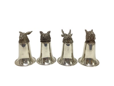 Lot 1231 - Set of four contemporary pewter stirrup cups with fox, pheasant, hare and stag mounts, by the English Pewter Company, 11cm high