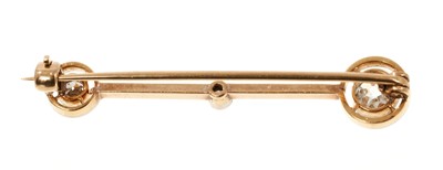 Lot 691 - Edwardian diamond comet with three old cut diamonds in platinum setting on a gold bar, estimated total diamond weight approximately 0.45-0.50cts. Length 39mm