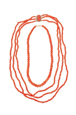 Lot 689 - 19th century coral bead necklace with a triple strand of coral beads on a gilt metal and carved coral clasp, 53cm, together with another coral bead necklace with a single sting of graduated beads,...