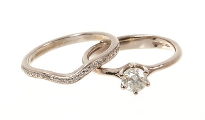 Lot 651 - Diamond single stone ring with a brilliant cut diamond estimated to weigh approximately 0.50ct in six claw setting on 18ct white gold shank, together with a matching diamond set band, both hallmark...