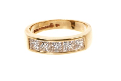 Lot 799 - Diamond half hoop eternity ring with five princess cut diamonds estimated to weigh approximately 1.25cts in 18ct gold channel setting, millennium hallmarks, London 2000. Ring size N.