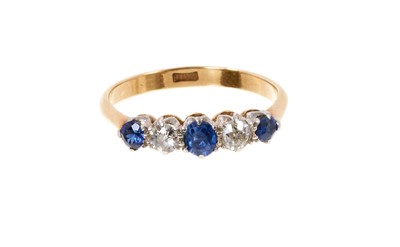 Lot 743 - Edwardian sapphire and diamond five stone ring with two old cut diamonds and three mixed cut blue sapphires in claw setting on 18ct gold shank, ring size N½.