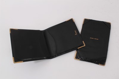 Lot 1012 - Two Asprey 9ct gold mounted leather wallets