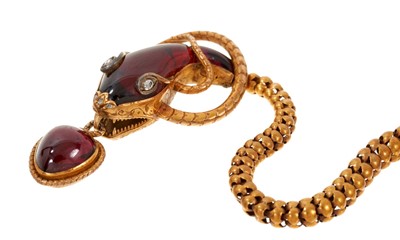 Lot 650 - A fine Victorian cabochon garnet and diamond gold snake necklace, the snake's head with open mouth suspending a cabochon garnet heart/pear shape drop with locket compartment to the reverse, further...