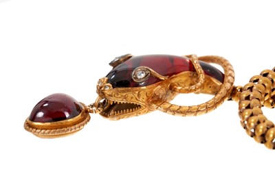 Lot 650 - A fine Victorian cabochon garnet and diamond gold snake necklace, the snake's head with open mouth suspending a cabochon garnet heart/pear shape drop with locket compartment to the reverse, further...