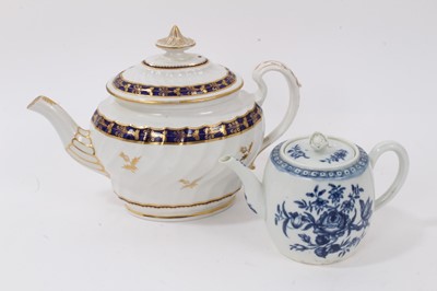 Lot 294 - A Worcester barrel shaped teapot and cover, c.1770, transfer printed in underglaze blue with the Rose-centred Spray Group pattern, 10.5cm high, and a large Worcester fluted teapot, c. 1800, 17.5cm...