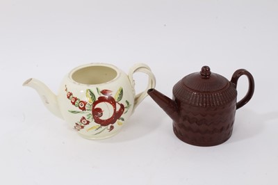 Lot 296 - Late 18th century creamware teapot with double strap handle, polychrome painted with flowers, together with a Nottingham/Staffordshire red ware teapot, c. 1810 (2)