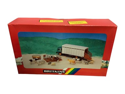 Lot 180 - Britains Farm Models Animal Transporter with cows, sheep, feed manager & pens, boxed No.9631 (1)