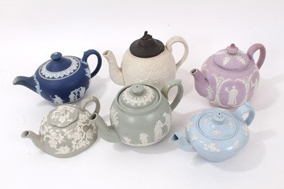 Lot 297 - Group of six 19th century relief moulded teapots, including one lilac jasperware teapot, one Aesthetic style with sprigged prunus decoration, etc