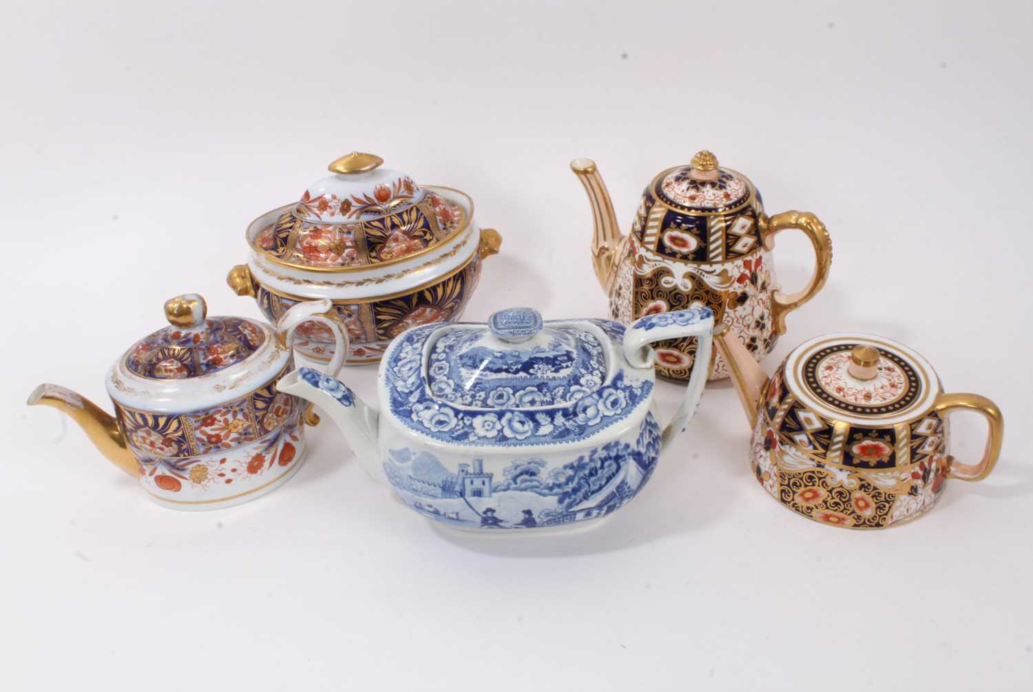 Lot 298 - Davenport Imari style coffee pot and teapot, together with a 19th century English Imari style teapot and sucrier set, and a blue and white Davenport teapot (5)