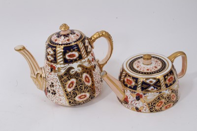 Lot 298 - Davenport Imari style coffee pot and teapot, together with a 19th century English Imari style teapot and sucrier set, and a blue and white Davenport teapot (5)