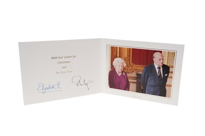 Lot 134 - H.M. Queen Elizabeth II and H.R.H. The Duke of Edinburgh 2019 signed Christmas card with twin gilt ciphers to cover, colour photograph of the Royal couple to the interior.