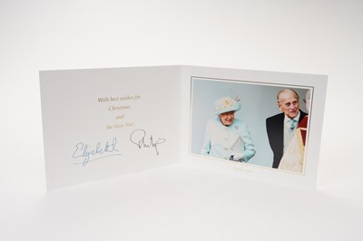 Lot 134 - H.M. Queen Elizabeth II and H.R.H. The Duke of Edinburgh 2019 signed Christmas card with twin gilt ciphers to cover, colour photograph of the Royal couple to the interior.