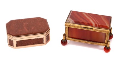 Lot 1059 - 19th century gold mounted and goldstone snuff box, of canted outline, 6cm wide, together with a banded agate miniature casket. (2)