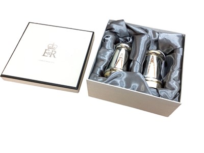 Lot 138 - H.M. Queen Elizabeth II, 2011 Royal Household Christmas gift of a pair of silver plated salt and pepper grinders