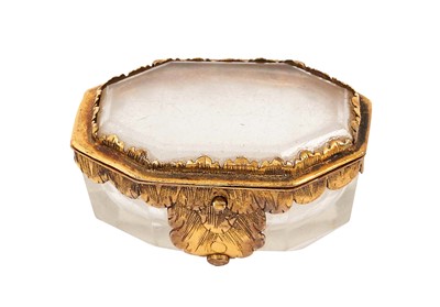 Lot 1080 - Early, probably 17th century gilt metal and glass miniature casket, of canted form, 4cm long