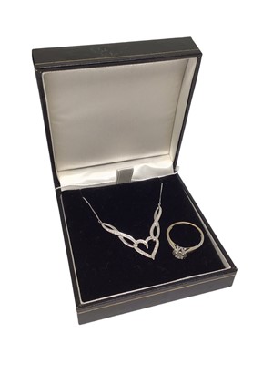 Lot 113 - 18ct white gold diamond single stone ring with diamond set shoulders and a 9ct white gold diamond set heart shaped necklace