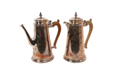 Lot 524 - 1960's Georgian style silver coffee pot, with fruitwood handle, (London 1962), together with a matching hot water pot (London 1963), maker Tessiers Ltd, all at 50ozs, coffee pot 24cm in height, hot...