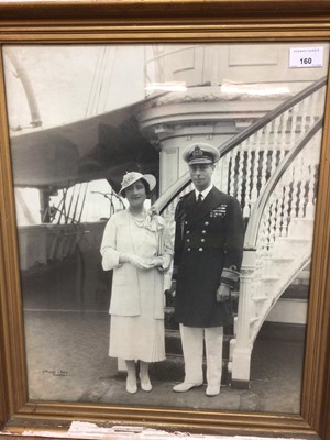 Lot 160 - T.M. King George VI and Queen Elizabeth, fine portrait photograph of the Royal couple on board the Royal Yacht Victoria & Albert, in gilt glazed frame 57 x 47cm and three framed photographs of H.M....