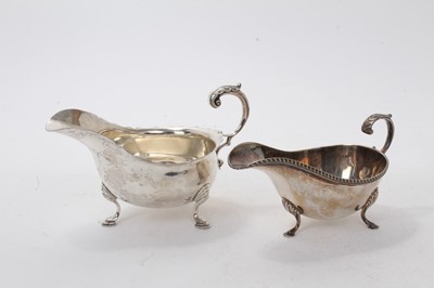 Lot 526 - George V silver sauce boat of conventional form, raised on three hoof feet and one other