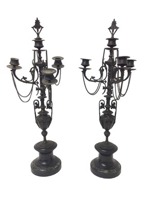 Lot 1122 - Pair of 19th century bronze three branch candelabra, raised on marble socle bases, 59cm high