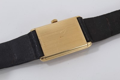 Lot 875 - Ladies Vacheron & Constantin 18ct gold wristwatch with mechanical wind movement, the rectangular black dial with gold baton hour markers in an 18ct gold tank shape case on leather strap, case 28 x...