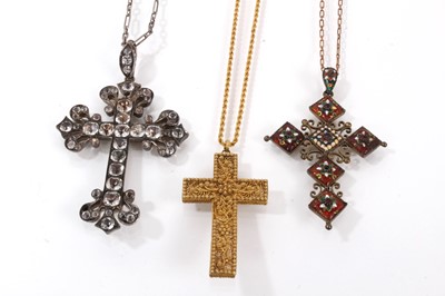 Lot 851 - Three antique cross pendants to include a gold filigree cross on rope twist chain, a paste-set silver cross on chain and an enamel and jewelled cross on chain (3)