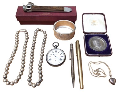 Lot 41 - Vintage silver hinged bangle, two white metal bead necklaces, silver heart shaped locket on chain, silver pocket watch retailed by John Myers & Co, an Elkington medal, a cigar cutter in Dunhill box...